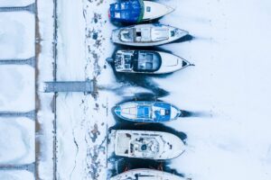 snow and ice damage on uncovered boats